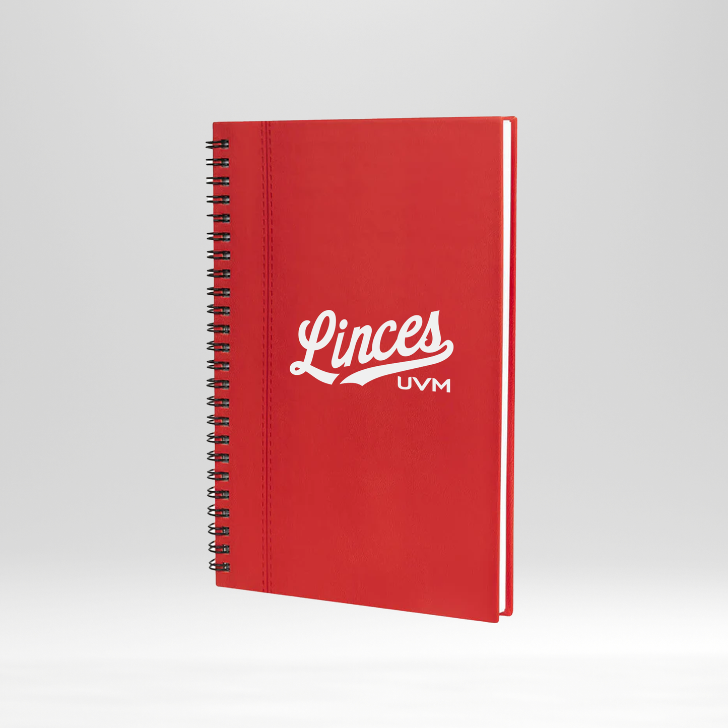 Libreta roja engargolada con lazo rojo linces UVM blanco