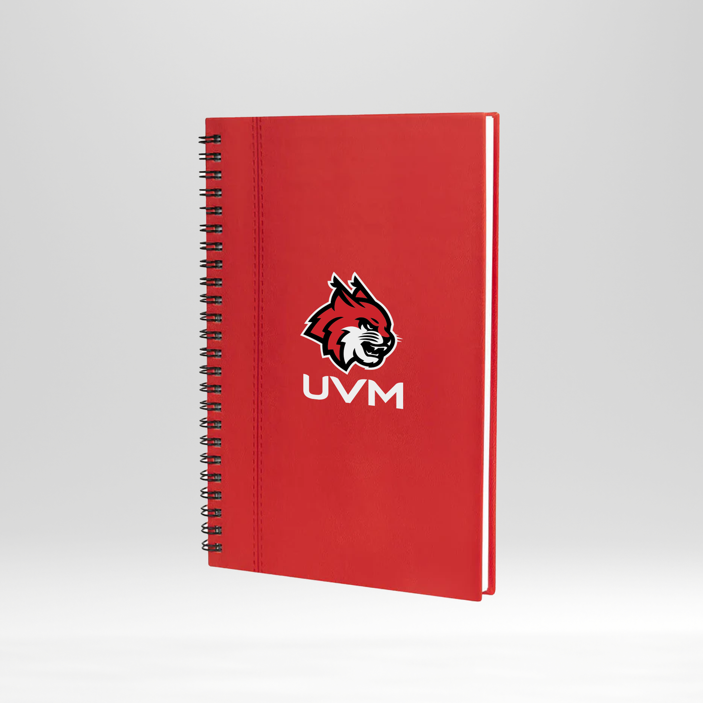 Libreta roja engargolada con lazo rojo UVM