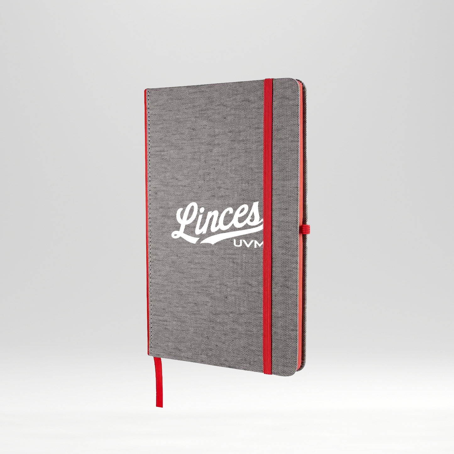 Libreta gris con detalles rojos linces UVM blanco