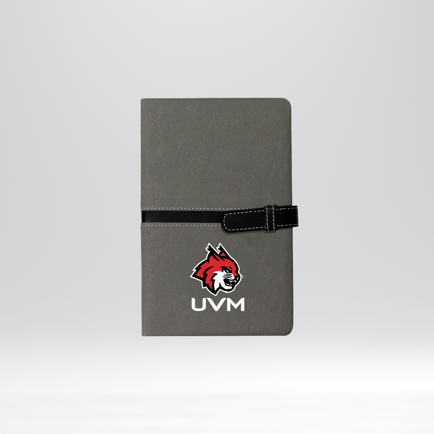 Libreta gris logo linces UVM blanco cierre negro