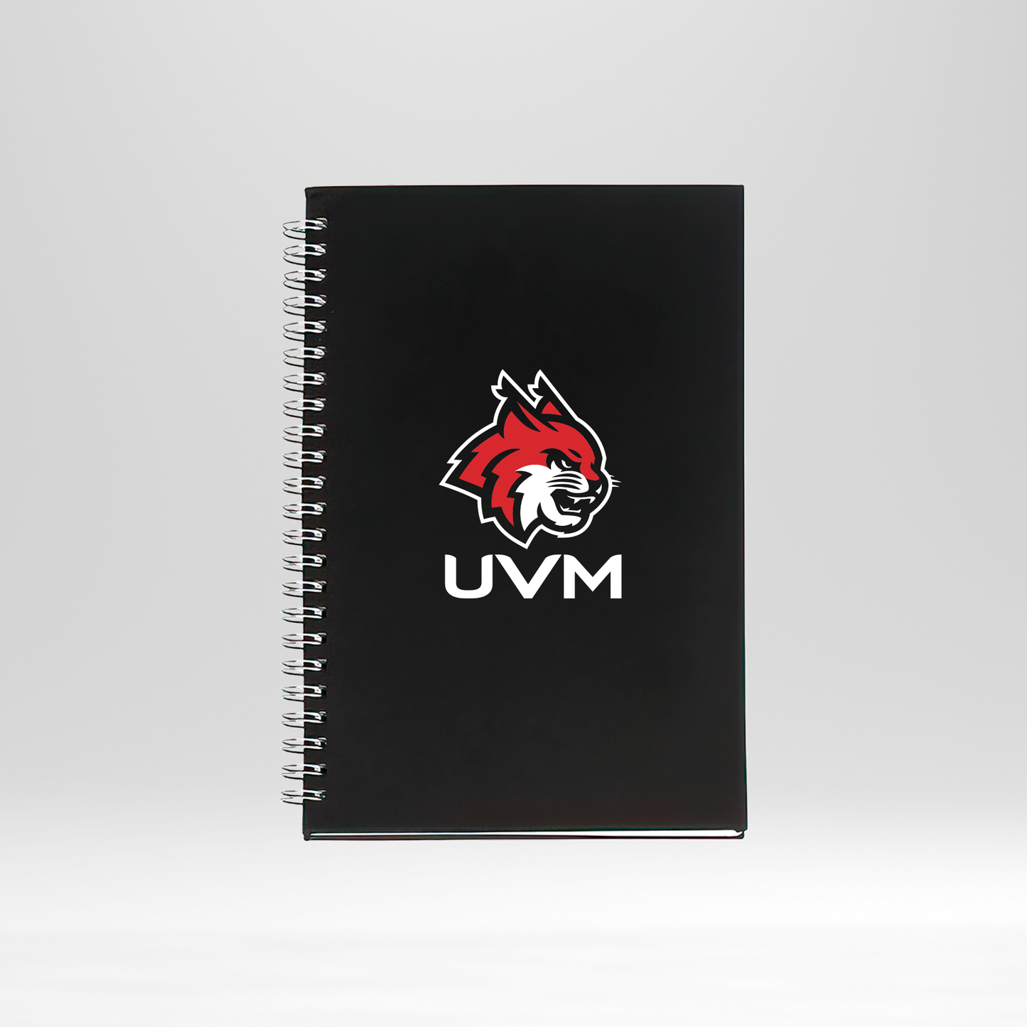 Libreta negra con engargolado logo linces UVM